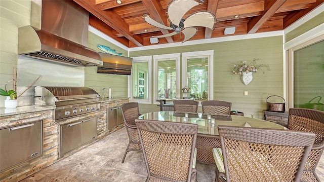 view of patio / terrace featuring exterior kitchen, outdoor dining area, a ceiling fan, area for grilling, and a sink