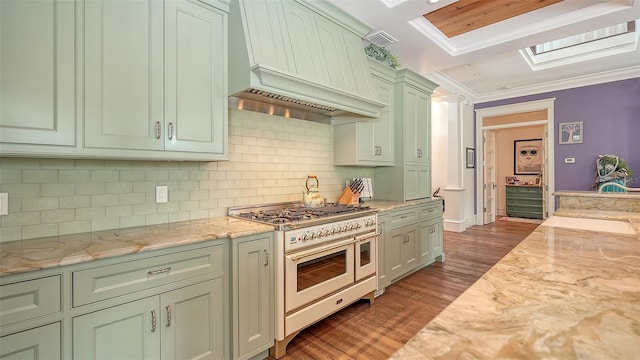 kitchen featuring double oven range, custom range hood, dark wood-style floors, ornamental molding, and backsplash
