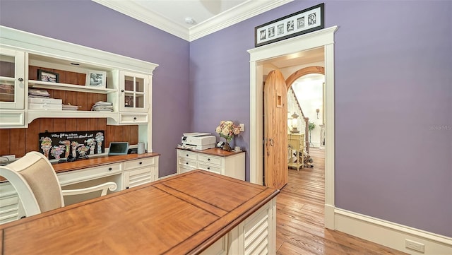 office space featuring crown molding and light wood-style floors