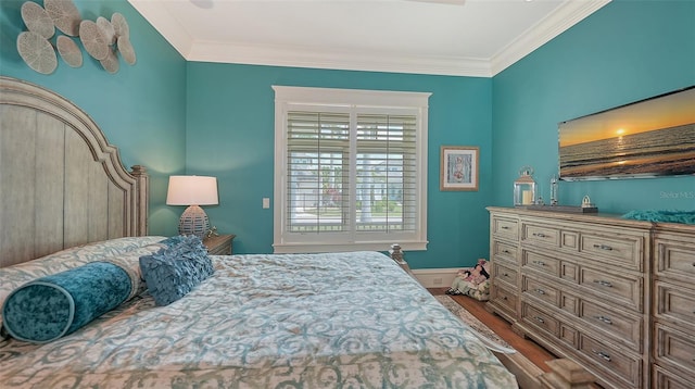 bedroom featuring dark wood-type flooring and crown molding
