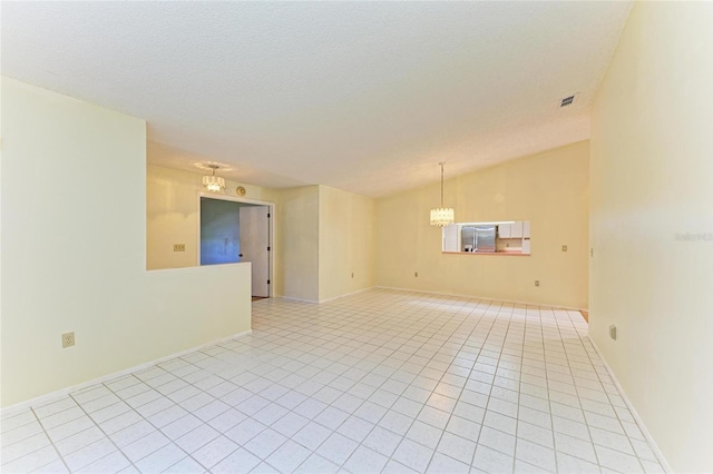 unfurnished room with an inviting chandelier, baseboards, lofted ceiling, and light tile patterned flooring