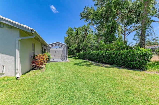 view of yard featuring a lanai
