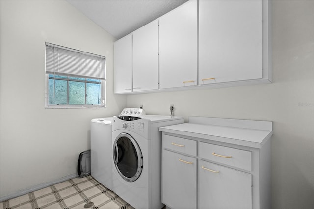 laundry area featuring cabinet space, independent washer and dryer, and light floors