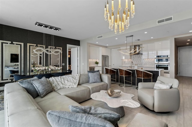 living area featuring a chandelier