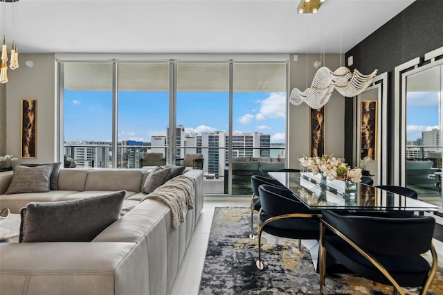 living room with a view of city, expansive windows, and plenty of natural light