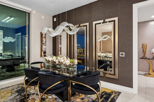 dining space featuring baseboards and tile patterned floors
