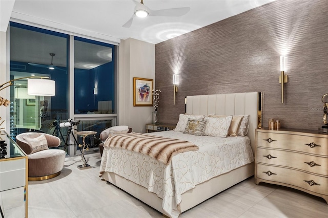 bedroom with ceiling fan and tile patterned flooring