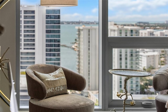 balcony featuring a view of city and a water view