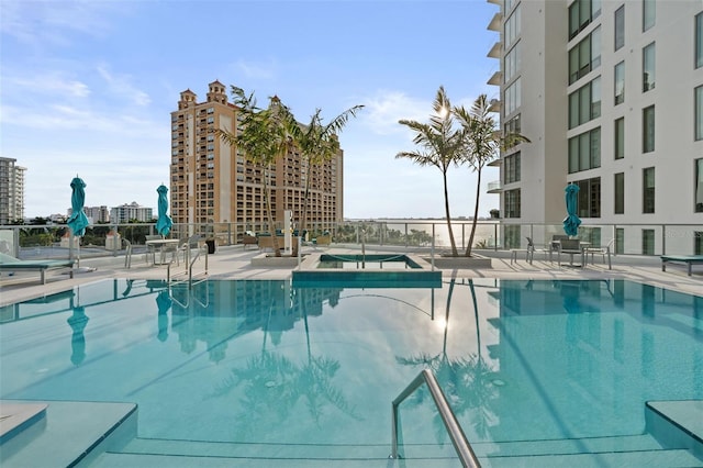 community pool with a patio area