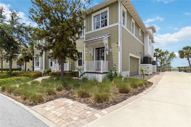 view of front of property featuring a garage, board and batten siding, and driveway