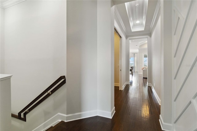 hallway featuring ornamental molding, dark wood-style floors, baseboards, and recessed lighting