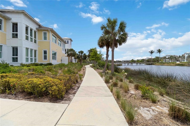 surrounding community featuring a water view