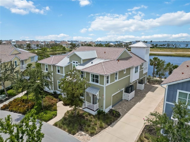 aerial perspective of suburban area featuring a nearby body of water