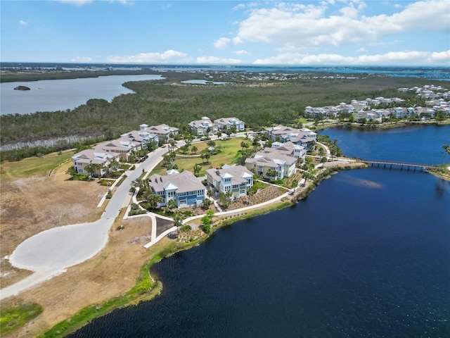 aerial overview of property's location featuring nearby suburban area and a large body of water