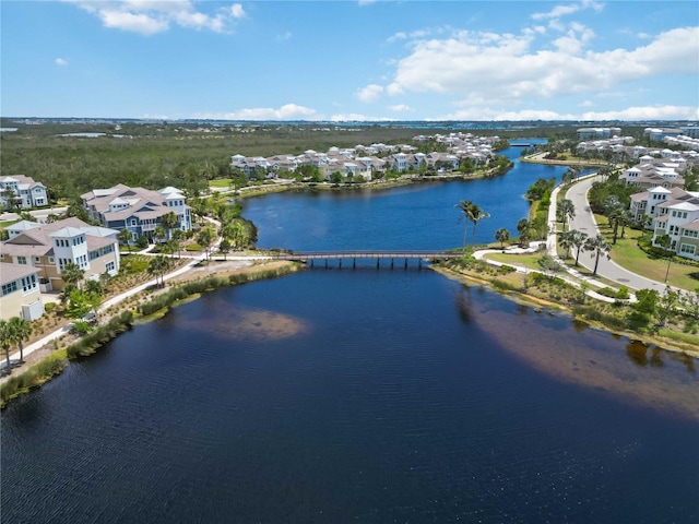 aerial overview of property's location featuring a nearby body of water, nearby suburban area, and a notable bridge