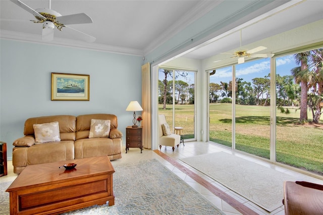 tiled living room with ceiling fan and ornamental molding