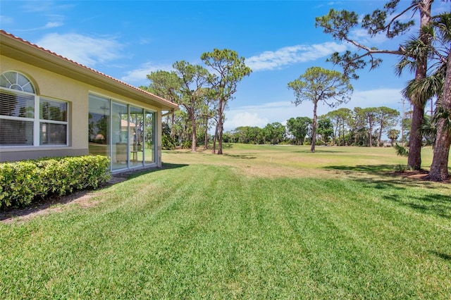 view of yard featuring a sunroom