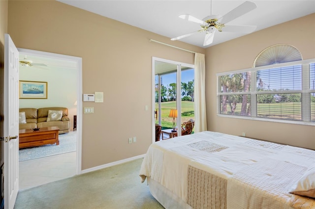 bedroom featuring light colored carpet, a ceiling fan, baseboards, and access to outside