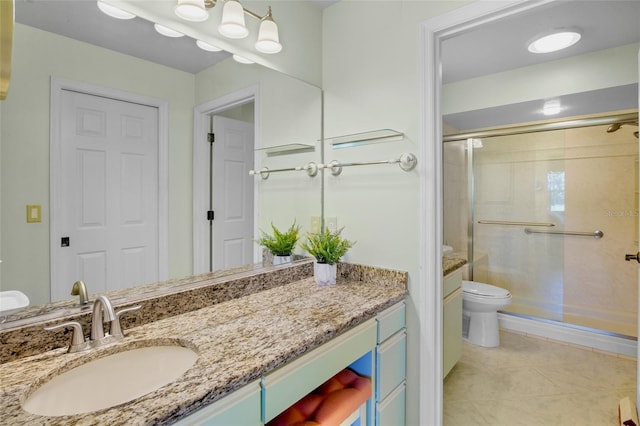 bathroom featuring tile patterned flooring, a stall shower, toilet, and vanity