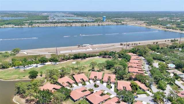 bird's eye view featuring a water view, golf course view, and a residential view