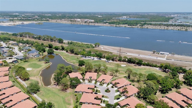 birds eye view of property with a water view, golf course view, and a residential view