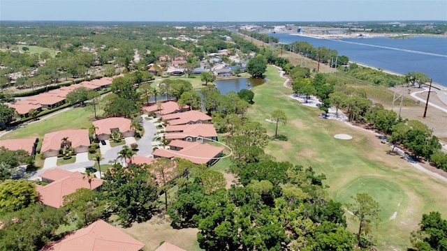 aerial view with a water view, a residential view, and golf course view