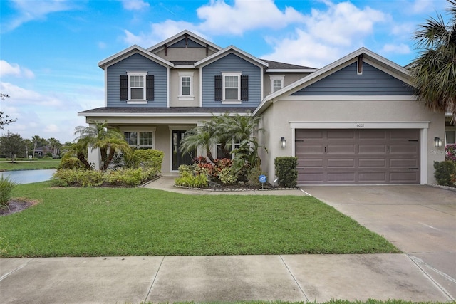 6001 Anise Dr, Sarasota, FL 34238 - view of front of home with a front lawn, stucco siding, and driveway