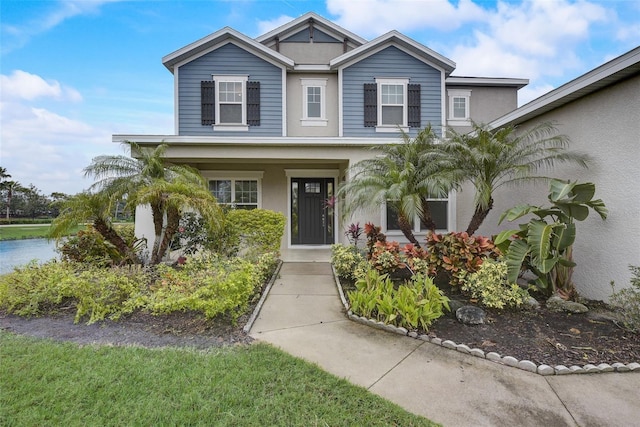 6001 Anise Dr, Sarasota, FL 34238 - view of front of property featuring a porch and stucco siding