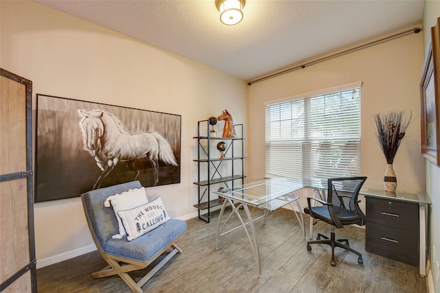 6001 Anise Dr, Sarasota, FL 34238 - office area with baseboards and wood finished floors