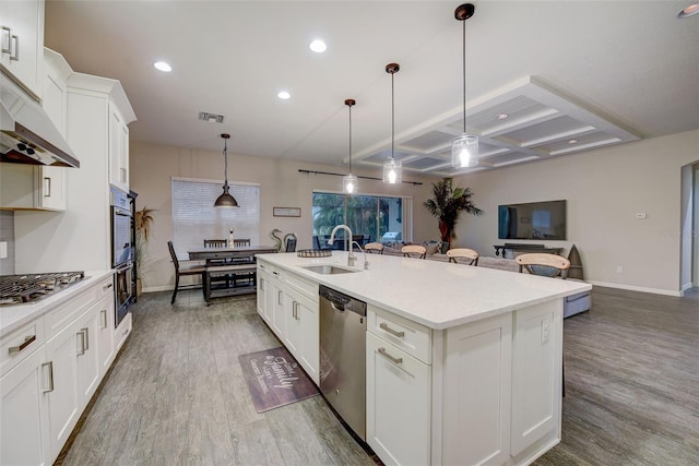6001 Anise Dr, Sarasota, FL 34238 - kitchen featuring visible vents, stainless steel appliances, a sink, open floor plan, and coffered ceiling