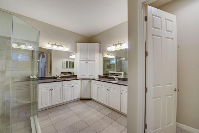 6001 Anise Dr, Sarasota, FL 34238 - bathroom with vanity, tile patterned floors, and a shower stall