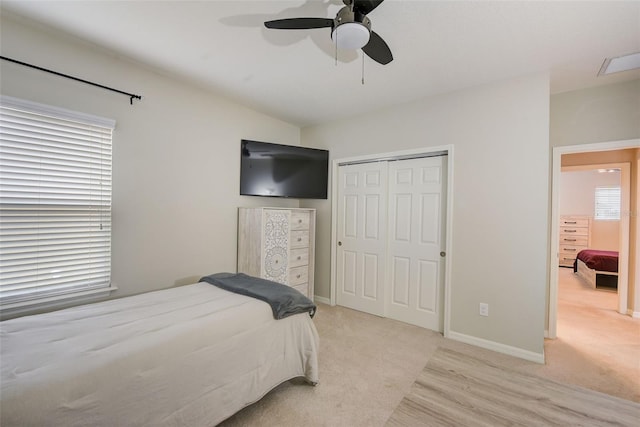 6001 Anise Dr, Sarasota, FL 34238 - bedroom featuring a ceiling fan, baseboards, light carpet, and a closet