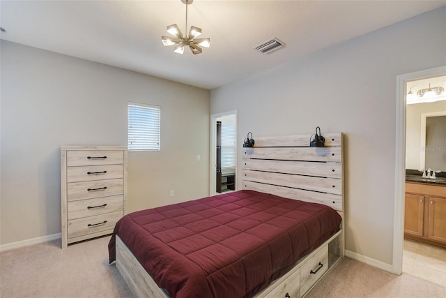 6001 Anise Dr, Sarasota, FL 34238 - bedroom with visible vents, light colored carpet, a sink, baseboards, and a chandelier