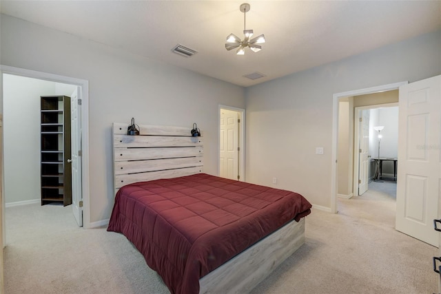 6001 Anise Dr, Sarasota, FL 34238 - bedroom with a chandelier, baseboards, visible vents, and light carpet