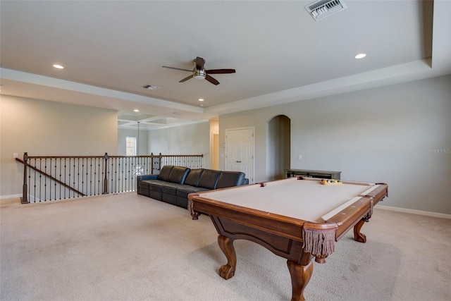 6001 Anise Dr, Sarasota, FL 34238 - recreation room featuring visible vents, ceiling fan, light colored carpet, a raised ceiling, and arched walkways