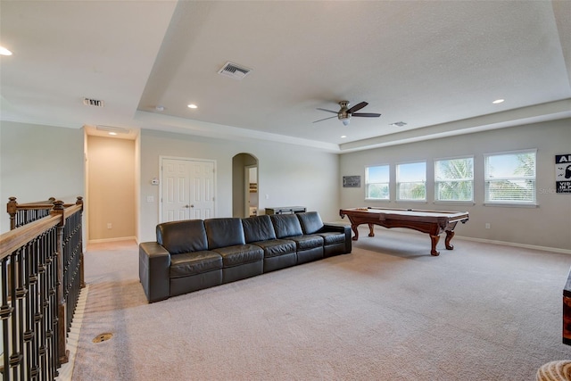 6001 Anise Dr, Sarasota, FL 34238 - living area featuring visible vents, arched walkways, carpet, and ceiling fan
