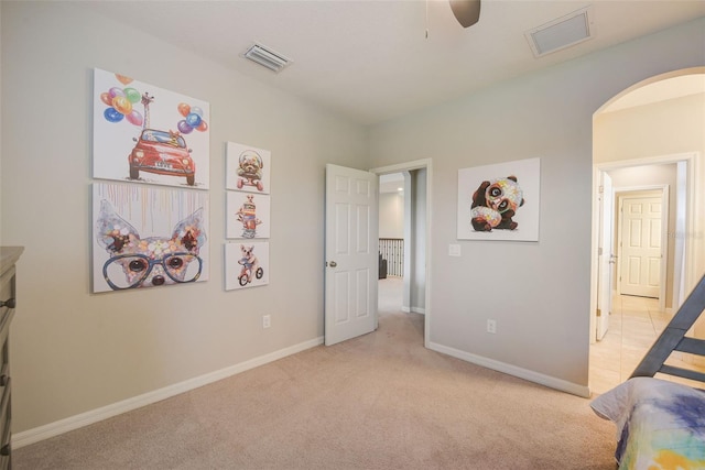 6001 Anise Dr, Sarasota, FL 34238 - bedroom with arched walkways, baseboards, light carpet, and visible vents