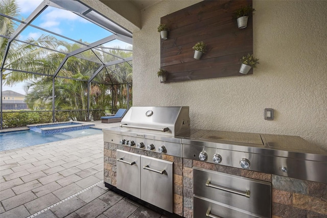 6001 Anise Dr, Sarasota, FL 34238 - view of patio / terrace featuring glass enclosure, a pool with connected hot tub, grilling area, and an outdoor kitchen