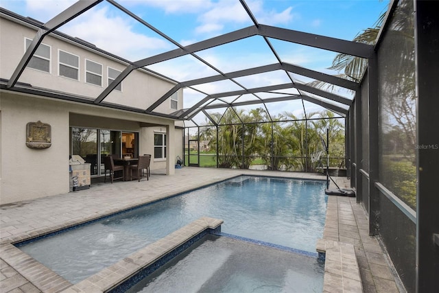 6001 Anise Dr, Sarasota, FL 34238 - view of swimming pool with a patio, outdoor dining area, a lanai, and a pool with connected hot tub