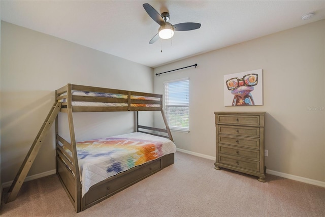 6001 Anise Dr, Sarasota, FL 34238 - bedroom with baseboards, ceiling fan, and light carpet