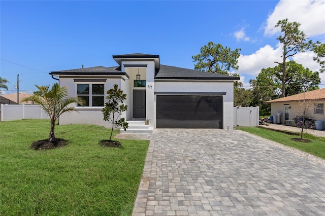 532 Yale Rd, Venice, FL 34293 - prairie-style home with decorative driveway, a garage, fence, and stucco siding