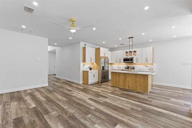 532 Yale Rd, Venice, FL 34293 - kitchen featuring visible vents, stainless steel appliances, light wood-type flooring, and open floor plan