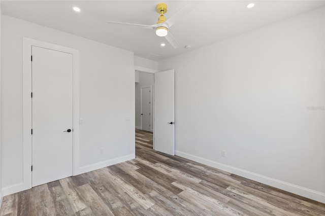 532 Yale Rd, Venice, FL 34293 - unfurnished bedroom featuring recessed lighting, baseboards, ceiling fan, and wood finished floors