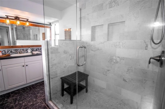 full bathroom with a stall shower and vanity
