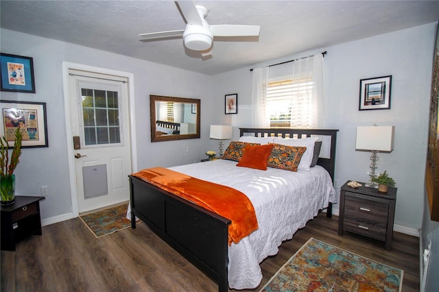 bedroom with baseboards, ceiling fan, and wood finished floors