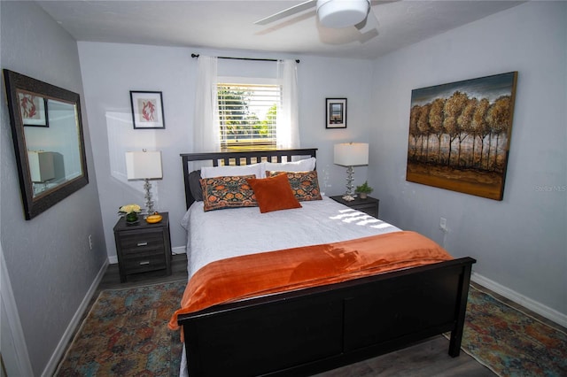 bedroom with baseboards, a ceiling fan, and wood finished floors