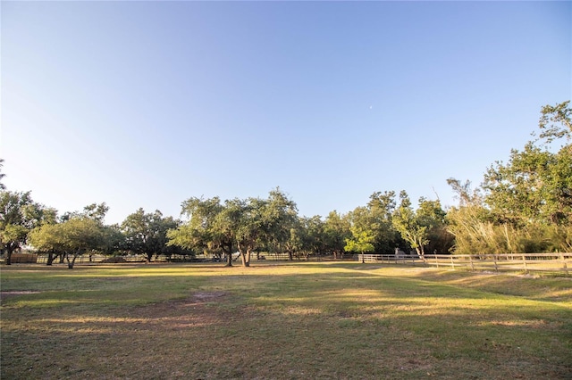 surrounding community featuring a yard and fence