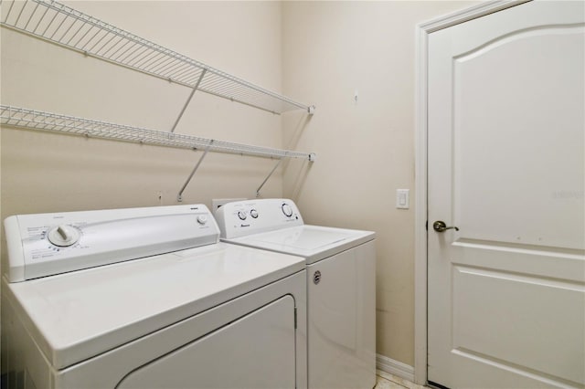 laundry area with separate washer and dryer and laundry area