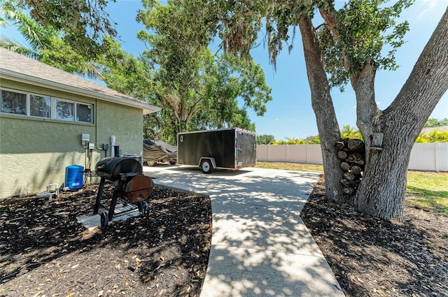 view of patio / terrace featuring fence