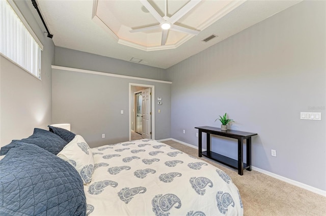 carpeted bedroom with ceiling fan, visible vents, and baseboards